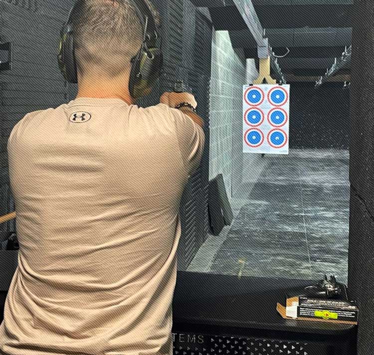 Freedom Firearms & Defense | Man practicing shooting at a target range.